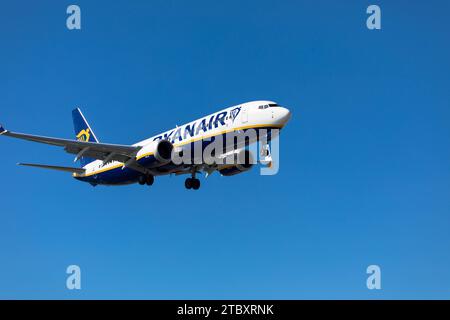 Airplane from the Ryanair on approach for landing. Blue sky. Close up. November 09, 2023. Arrecife, Canary Island, Spain Stock Photo