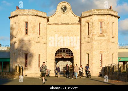 Visitors leaving through the entrance to the historical Fremantle Prison, now a tourist site in the port of Fremantle, Perth, Western Australia. Stock Photo