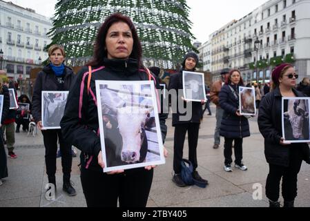 Madrid, Spain. 09th Dec, 2023. Dozens of people hold photographs of animals during a demonstration for International Animal Rights Day at Puerta del Sol, on December 9, 2023, in Madrid, Spain. (Photo by Oscar Gonzalez/Sipa USA) (Photo by Oscar Gonzalez/Sipa USA) Credit: Sipa USA/Alamy Live News Stock Photo