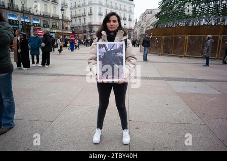 Madrid, Spain. 09th Dec, 2023. Dozens of people hold photographs of animals during a demonstration for International Animal Rights Day at Puerta del Sol, on December 9, 2023, in Madrid, Spain. (Photo by Oscar Gonzalez/Sipa USA) (Photo by Oscar Gonzalez/Sipa USA) Credit: Sipa USA/Alamy Live News Stock Photo