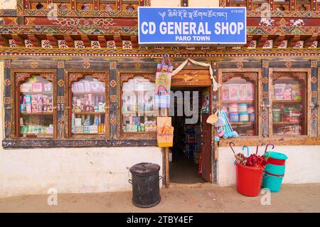 A general shop selling a wide range of products with features of traditional Bhutanese architecture on the exterior in the town of Paro, Bhutan. Stock Photo