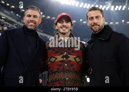 Turin, Italy. 8th Dec, 2023. Former Juventus players Andrea Barzagli ( left ) and Claudio Marchisio ( right ) pose with Francesco ( Pecco ) Bagnaia ( centre ) Italian motorcycle racer and Winner of the 2023 MotoGP ( his second title ) prior to kick off in the Serie A match at Allianz Stadium, Turin. Picture credit should read: Jonathan Moscrop/Sportimage Credit: Sportimage Ltd/Alamy Live News Stock Photo