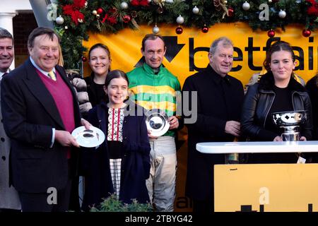 Jockey Nico de Boinville, trainer Nicky Henderson and owner John P McManus after winning the Betfair Tingle Creek Chase with Jonbon during day two of The Betfair Tingle Creek Festival at Sandown Park Racecourse, Esher. Picture date: Saturday December 9, 2023. Stock Photo