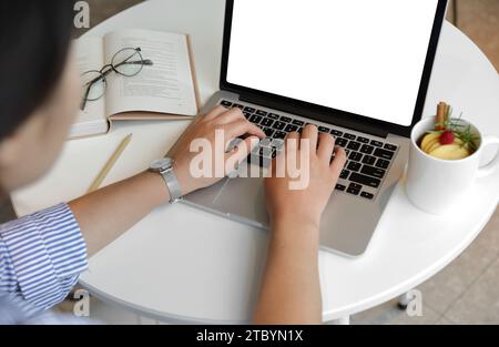 A woman who works or creates alone in a cafe Stock Photo
