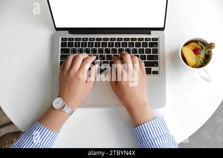 A woman who works or creates alone in a cafe Stock Photo