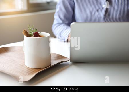 A woman who works or creates alone in a cafe Stock Photo