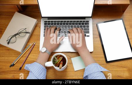 A woman who works or creates alone in a cafe Stock Photo