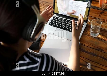 Woman having a video conference with her partner via laptop Stock Photo