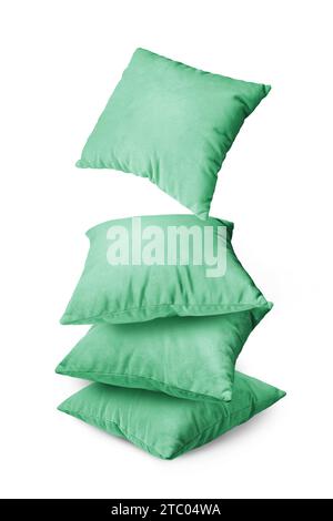 Stack of green pillows isolated on white background. Pile of  decorative cushions for sleeping and resting, home interior, house decor. Stock Photo
