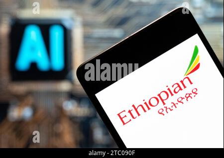 In this photo illustration, the national airline of Ethiopia, Ethiopian Airlines,  logo seen displayed on a smartphone with an Artificial intelligence (AI) chip and symbol in the background. Stock Photo