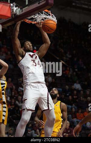 Blacksburg, VA, USA. 9th Dec, 2023. Virginia Tech Hokies forward Mylyjael Poteat (34) dunks the ball during the NCAA basketball game between the Valparaiso Beacons and the Virginia Hokies at Cassell Coliseum in Blacksburg, VA. Jonathan Huff/CSM/Alamy Live News Stock Photo