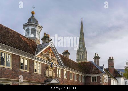 Buildings along Salisbury High Street with view towards Salisbury Cathedral spire, Salisbury, Wiltshire, England, UK Stock Photo