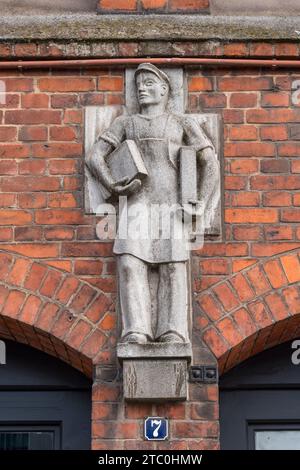 Stonework detail on the exterior of one re brick warehouse in the Speicherstadt district of Hamburg, Germany. Stock Photo
