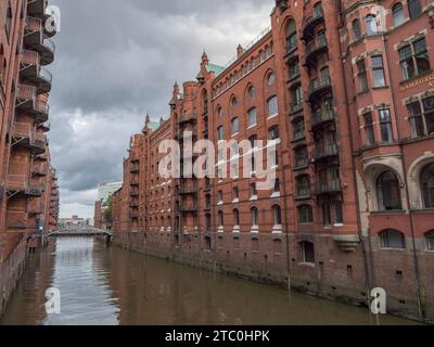 General view of stunning converted red brick warehouse viewed from the Wandbereiterbrücke in the Speicherstadt district of Hamburg, Germany. Stock Photo