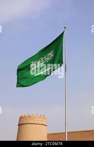 National Flag of Saudi Arabia flying at Masmak Fortress in Riyadh Stock Photo