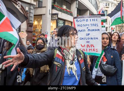 London, UK. 9 Dec 2023: A muslim nurse and healthcarev workers  at a large pro-Palestinian protest calling for an end to Israeli attacks on Gaza. Credit: Andy Soloman/Alamy Live News Stock Photo
