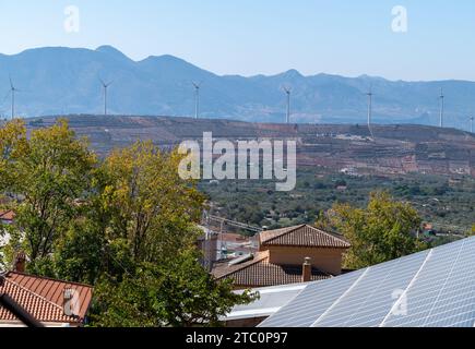 Solar panels and wind energy mills in the Granada town of Nigüelas (Spain) Stock Photo