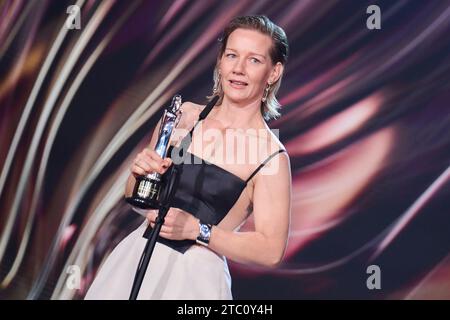 Berlin, Germany. 09th Dec, 2023. Sandra Hüller, actress, receives her award in the 'European Actress' category for the film 'Anatomy of a Case' at the European Film Awards ceremony. The European Film Academy (EFA) presents the awards at a gala in the Arena Berlin. Credit: Annette Riedl/dpa/Alamy Live News Stock Photo