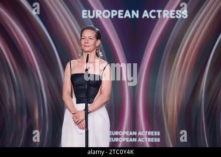 Berlin, Germany. 09th Dec, 2023. Sandra Hüller, actress, receives her award in the 'European Actress' category for the film 'Anatomy of a Case' at the European Film Awards ceremony. The European Film Academy (EFA) presents the awards at a gala in the Arena Berlin. Credit: Annette Riedl/dpa/Alamy Live News Stock Photo