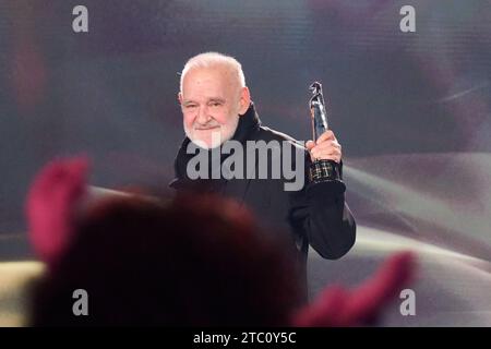 Berlin, Germany. 09th Dec, 2023. Bela Tarr, director, receives the 'Honorary Award of the Academy President and Board' at the European Film Awards in the Arena Berlin. The film prize has been awarded by the European Film Academy (EFA) since 1988. Credit: Annette Riedl/dpa/Alamy Live News Stock Photo