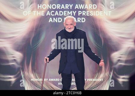 Berlin, Germany. 09th Dec, 2023. Bela Tarr, director, receives the 'Honorary Award of the Academy President and Board' at the European Film Awards in the Arena Berlin. The film prize has been awarded by the European Film Academy (EFA) since 1988. Credit: Annette Riedl/dpa/Alamy Live News Stock Photo