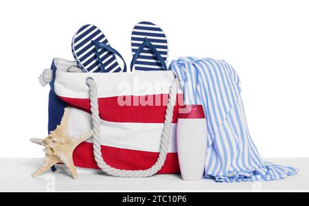 Stylish bag, starfish and other beach accessories isolated on white Stock Photo
