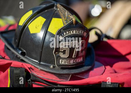 A fire helmet atop a firefighter's gear bag. Stock Photo