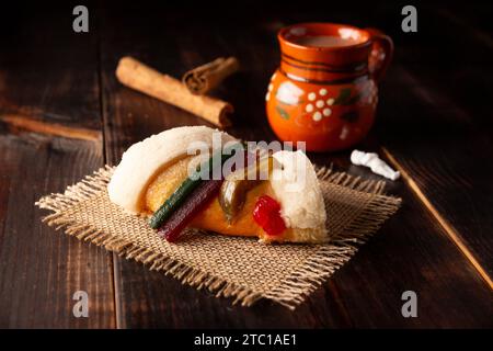 Traditional Kings day cake also called Rosca de Reyes, roscon, Epiphany Cake and with a clay Jarrito. Mexican tradition on January 5th Stock Photo