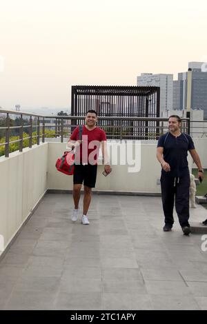 Couple of Latin men dressed in sportswear ready to exercise and lose weight as New Year's resolution Stock Photo