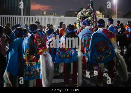 Mexico City, Mexico City, Mexico. 9th Dec, 2023. Members of the dance of the Quetzals, in the Basilica of Guadalupe as part of their pilgrimage and celebrations in honour of the Virgin Mary on 12 December. (Credit Image: © Luis E Salgado/ZUMA Press Wire) EDITORIAL USAGE ONLY! Not for Commercial USAGE! Stock Photo