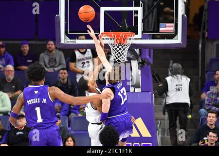 Seattle, WA, USA. 09th Dec, 2023. Washington Huskies forward Moses Wood (13) blocks a shot during the NCAA basketball game between the Gonzaga Bulldogs and Washington Huskies at Hec Edmundson Pavilion in Seattle, WA. Washington defeated Gonzaga 78-73. Steve Faber/CSM/Alamy Live News Stock Photo