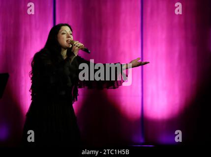 Mexico City, Mexico. 09th Dec, 2023. Mon Laferte, a Chilean singer, is performing during a sold-out concert at the Palacio de Bellas Artes in Mexico City, on December 09, 2023, accompanied by the Viento Florido Orchestra, which is composed of 48 women musicians from various indigenous communities in the State of Oaxaca. They are paying tribute to Chavela Vargas, Vivir Quintana, and Juan Gabriel. (Photo by Gerardo Vieyra/NurPhoto) Credit: NurPhoto SRL/Alamy Live News Stock Photo