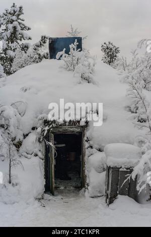 Saariselka, Finland - November 29, 2010: A Sami 'kota' covered with snow. The kota (also goahti), is a Sami hut or tent. Stock Photo