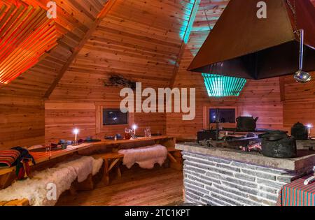 Saariselka, Finland - November 29, 2010: In a Sami 'kota' used to host a dinner event for tourists. The kota (also goahti), is a Sami hut or tent. It Stock Photo