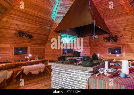 Saariselka, Finland - November 29, 2010: In a Sami 'kota' used to host a dinner event for tourists. The kota (also goahti), is a Sami hut or tent. It Stock Photo