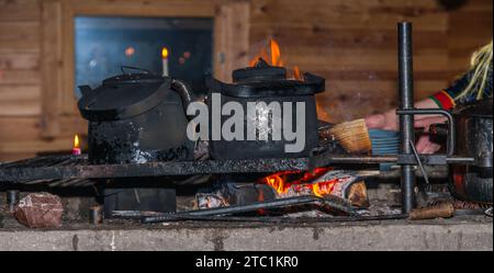 Saariselka, Finland - November 29, 2010: Fireplace in a Sami 'kota' used to host a dinner event for tourists. Stock Photo