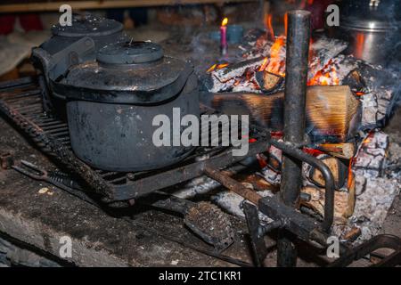 Saariselka, Finland - November 29, 2010: Fireplace in a Sami 'kota' used to host a dinner event for tourists. Stock Photo