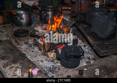 Saariselka, Finland - November 29, 2010: Fireplace in a Sami 'kota' used to host a dinner event for tourists. Stock Photo