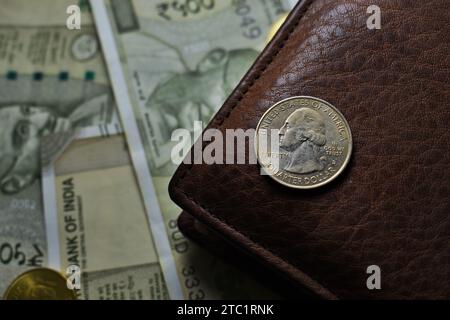 US Quarter dollar is stacked under United States geographical map with wallet Stock Photo