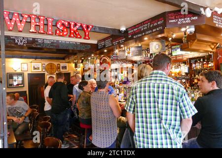 St Andrews, Scotland - July 31 2016: Traditional whisky pub with bar in Scotland Stock Photo