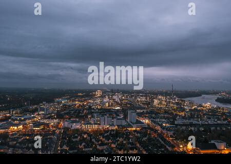 Leverkusen, North Rhine-Westphalia, Germany. Aerial night skyline view of the illuminated Chempark (Bayerwerk) plant, industrial park Bayer AG Stock Photo