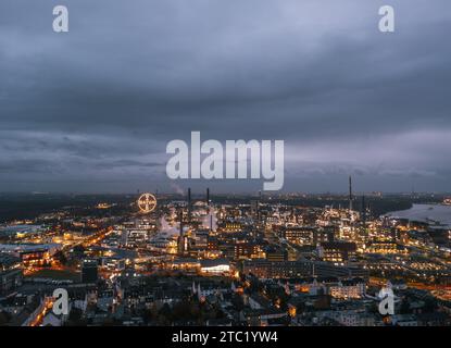 Leverkusen, North Rhine-Westphalia, Germany. Aerial night skyline view of the illuminated Chempark (Bayerwerk) plant, industrial park Bayer AG Stock Photo