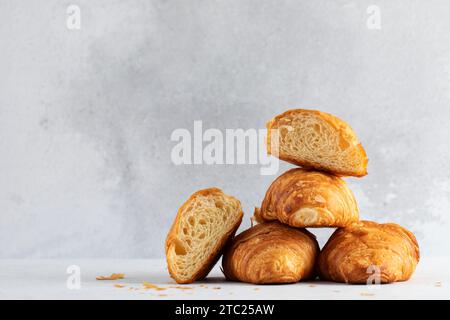 Fresh croissants on a grey background. French breakfast. Copy space Stock Photo