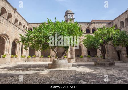 Alcantara, Spain - Oct 6th, 2022: Gothic Cloister of Convent of San Benito de Alcantara, Caceres, Spain. Courtyard Stock Photo