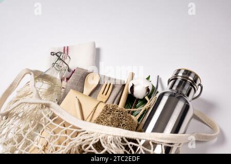 Eco-friendly material supplies in an eco-friendly net bag. Isolated on a white background Stock Photo
