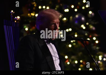 Manhattan, United States. 09th Dec, 2023. Former US President Donald J. Trump says that when someone indicts him legally, he considers it a 'great badge of courage.' Former President of the United States Donald J. Trump is delivering remarks at the New York Young Republican Club 111th Gala in Manhattan. He is talking about his comments on being a dictator, the lawsuits and criminal trials he is facing, and the 2024 election. Credit: SOPA Images Limited/Alamy Live News Stock Photo