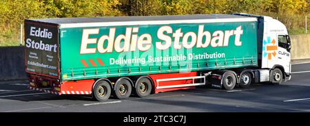 Culina Group logo on white hgv Scania lorry truck & soft sided Eddie Stobart curtain semi trailer not Culina updated driving on M25 motorway road UK Stock Photo