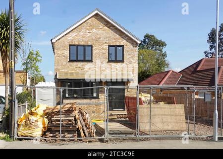 Series of 37 images work in progress on detached house final stages & external works started shows site security fence adequate for rural village UK Stock Photo