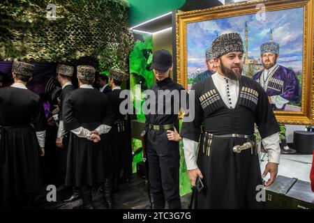 Moscow, Russia. 10th of December, 2023. A painting of Chechnya's First President Akhmat Kadyrov and Chechen Republic Head Ramzan Kadyrov is seen at the opening of Chechen Republic Day during the Russia Expo international exhibition and forum at the VDNKh exhibition centre in Moscow, Russia. Credit: Nikolay Vinokurov/Alamy Live News Stock Photo