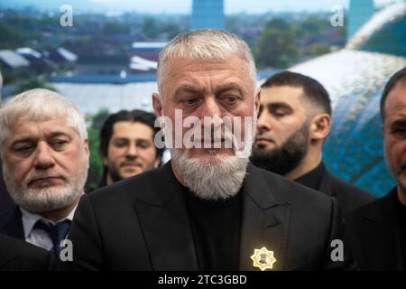 Moscow, Russia. 10th of December, 2023. Lawmaker Adam Delimkhanov (C) attends the opening of Chechen Republic Day during the Russia Expo international exhibition and forum at the VDNKh exhibition centre in Moscow, Russia. Credit: Nikolay Vinokurov/Alamy Live News Stock Photo